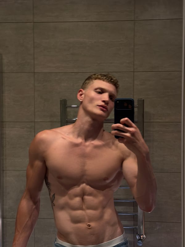 Young men document casual selfie session in London apartments