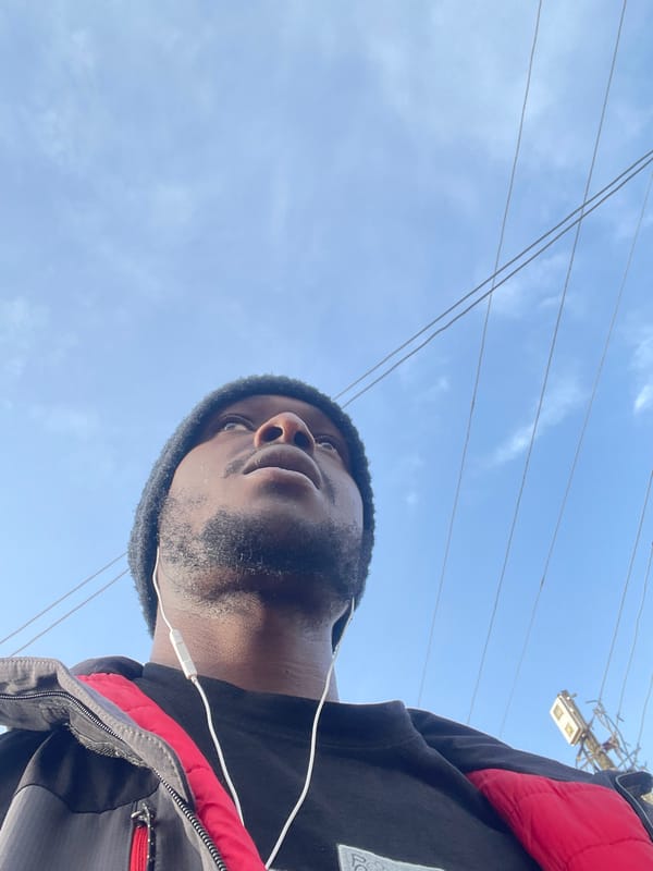 Man gazes skyward in Jos morning scene