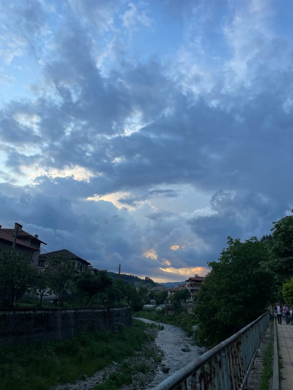 Storm clouds gather over Zlatograd riverside during evening hours