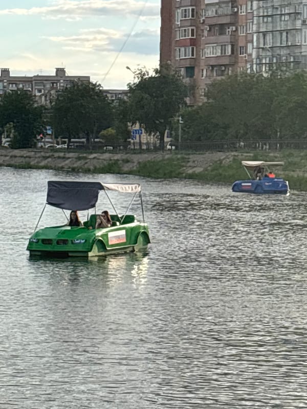 Astrakhan riverfront on a summer afternoon — boats, parks, promenades