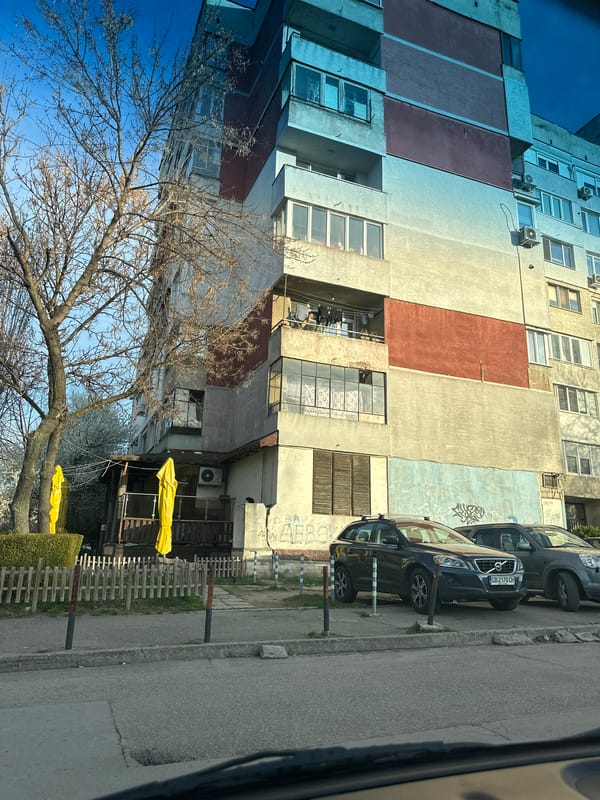 Everyday moments documented in Sofia: apartment building, mirror selfie