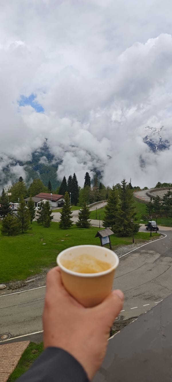 Morning coffee and mountain views captured in Russia