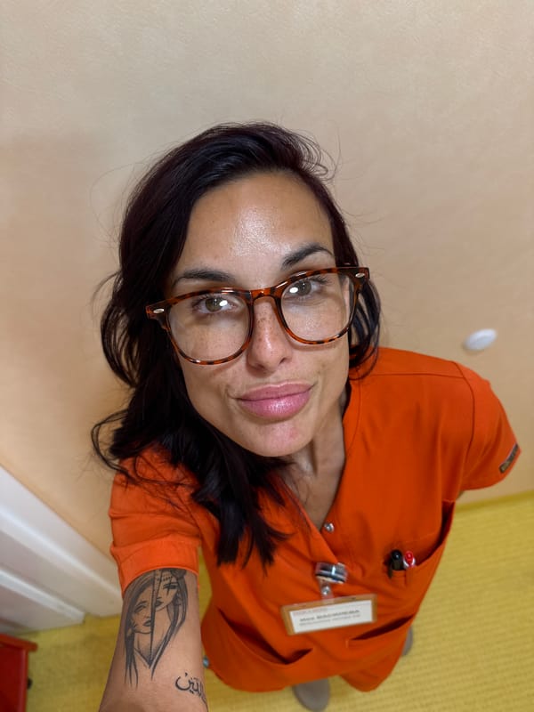 Quick selfies in orange scrubs at a Pleven healthcare facility