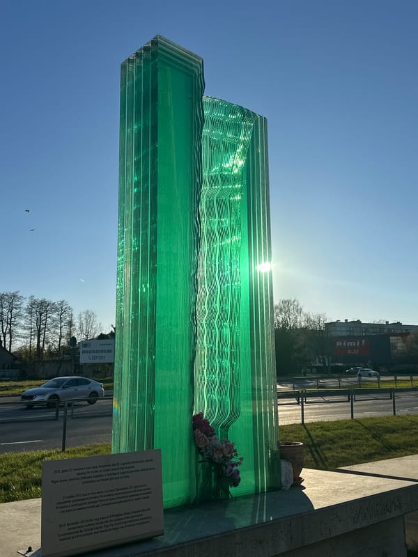 Green glass memorial sculpture observed in Riga, Latvia