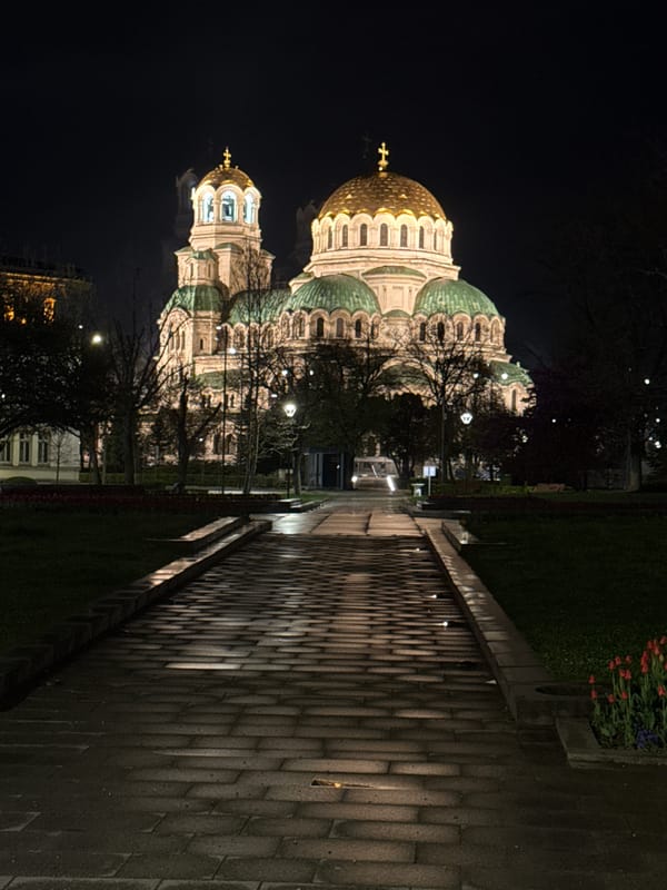 Sofia nightlife captured: cathedral illumination and indoor venue activity