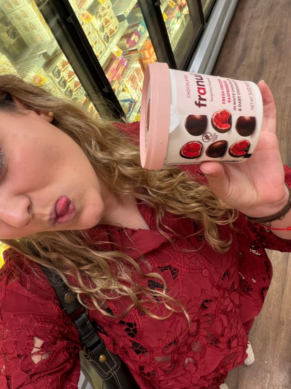 Woman holds Franui chocolate container in Key Biscayne