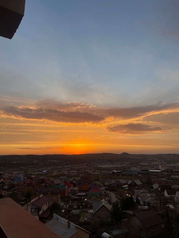 Evening sky observed over Krasnoyarsk residential neighborhoods