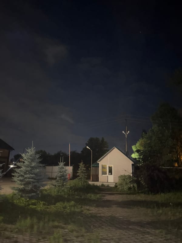 Quiet nighttime scene around a small outdoor café