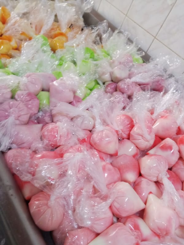 Colorful frozen treats sold in bags at Tinaquillo vendor
