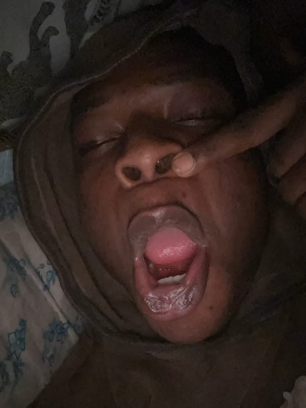 Person captures playful selfie session in Ikorodu bedroom
