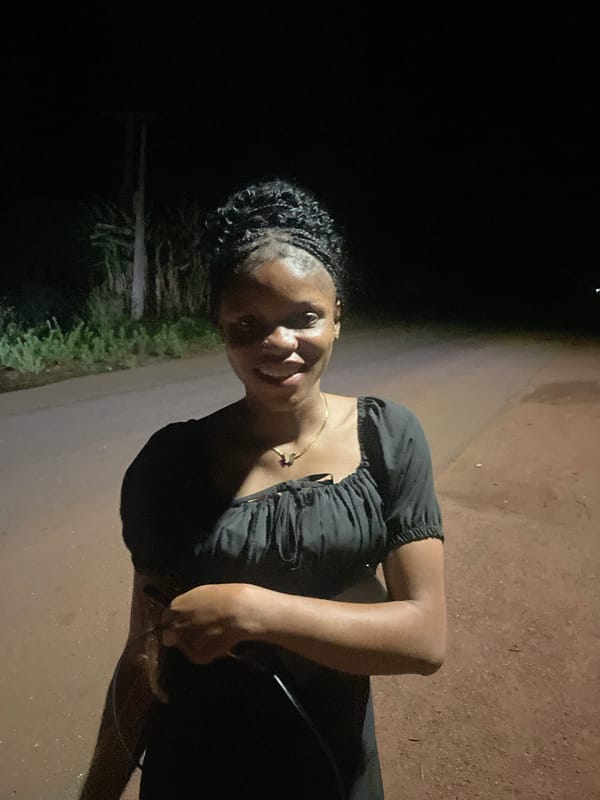 Woman observed on dirt road in Ogbe, Nigeria