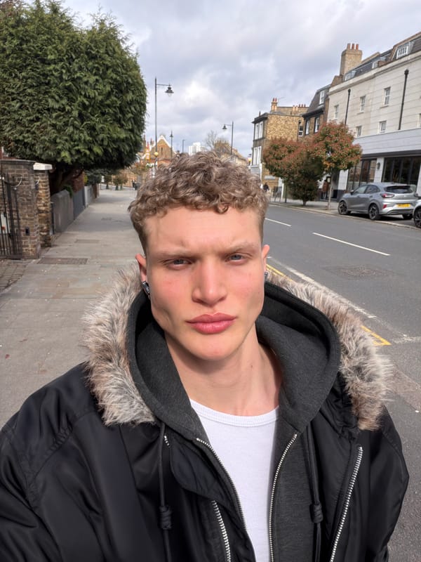 Young man in winter layers photographed in London