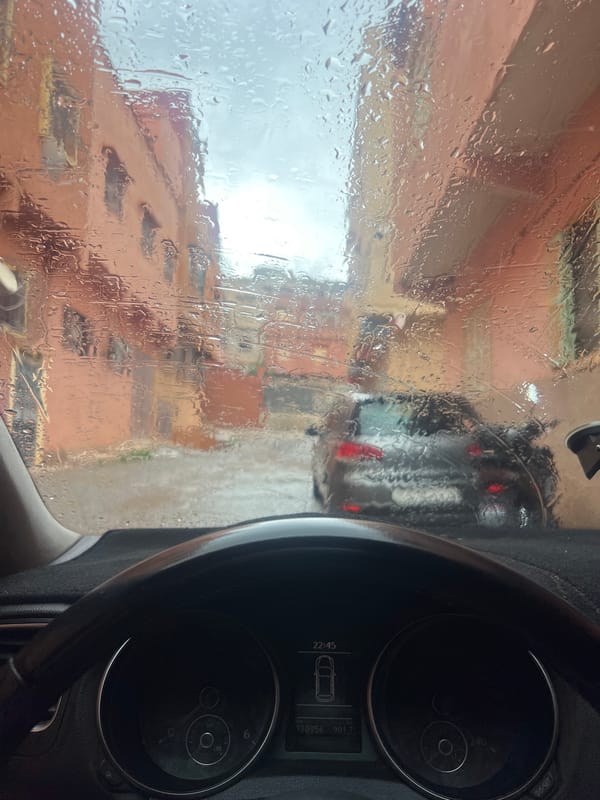 Rainy morning drive documented through Ouaouizert, Morocco streets