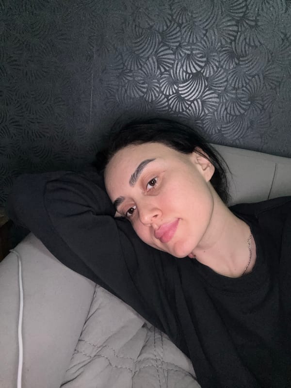 Woman photographed relaxing indoors in Tbilisi, Georgia