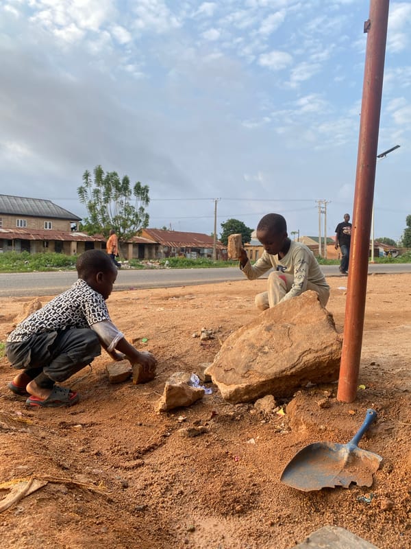 Children Play with Rocks, Balloons in Nigerian Towns
