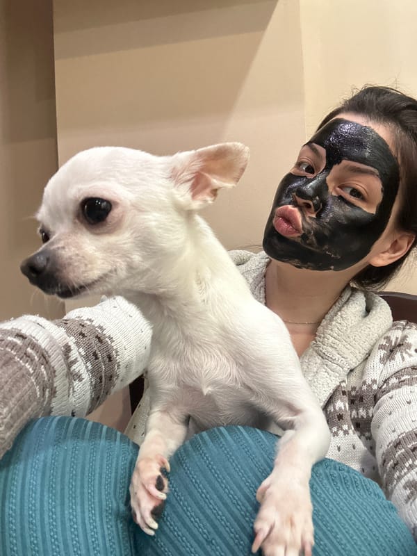 Woman relaxes with chihuahua during skincare routine in Bulgaria