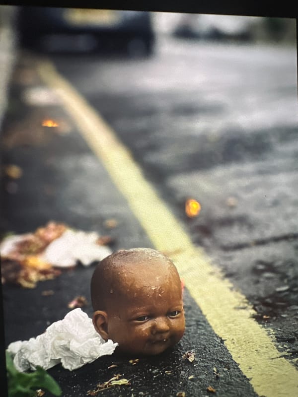 London evening scenes: discarded doll, man at table