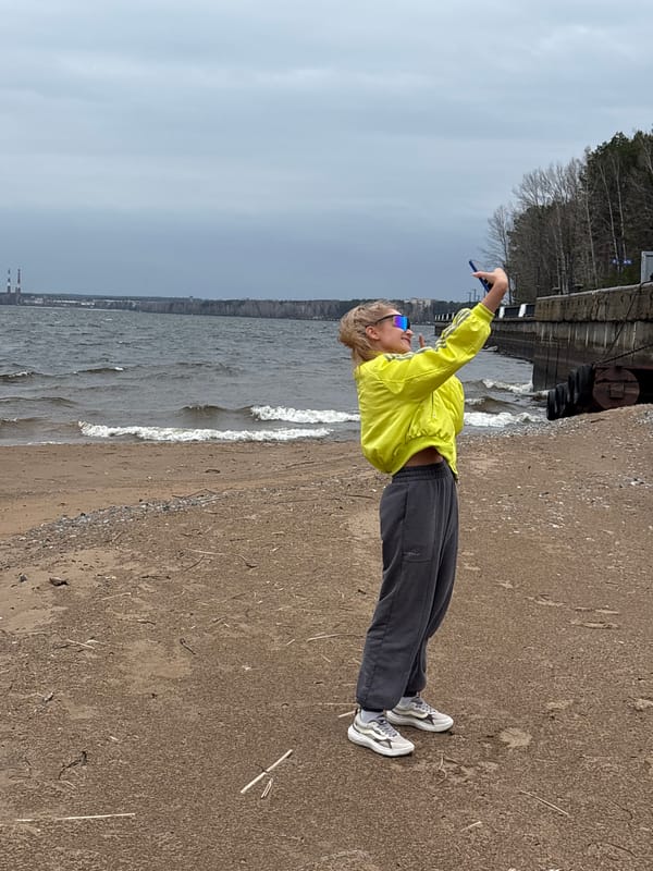 Woman enjoys morning riverside outing in Chaikovsky, Russia