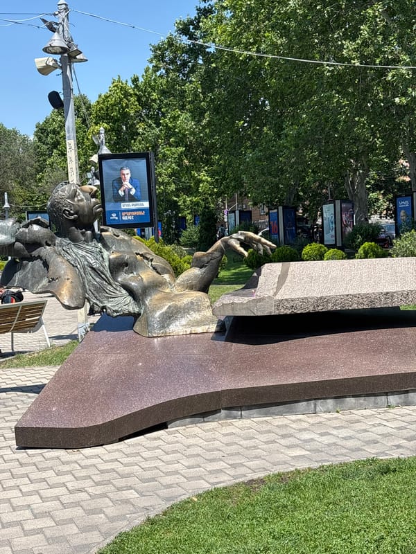 Tourist documents morning walking tour of central Yerevan landmarks