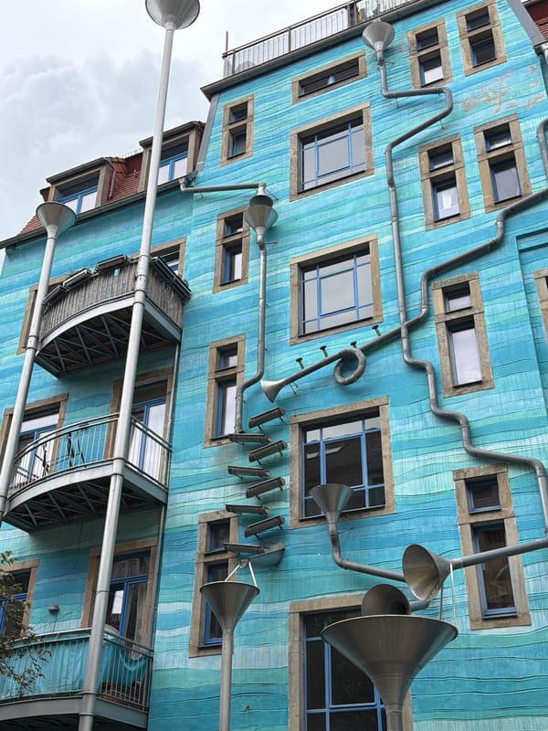 Witnesses document colorful artistic building facades in urban setting