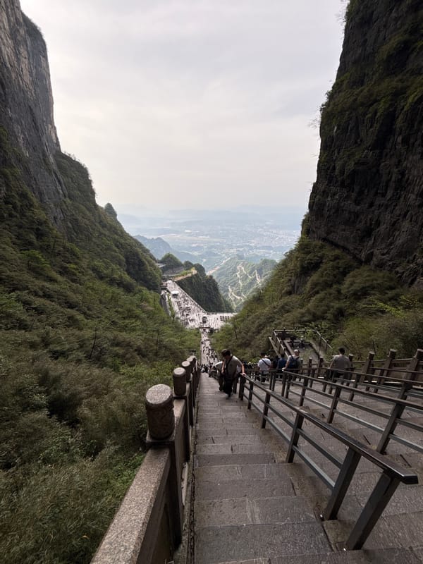 Tourist photographs famous Tianmen Mountain stairway in Zhangjiajie