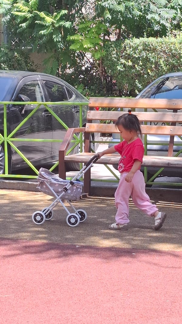 Summer morning at a Shymkent courtyard playground