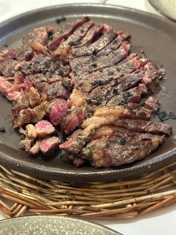 Lunch spread at a Gijón restaurant, steak and white beans