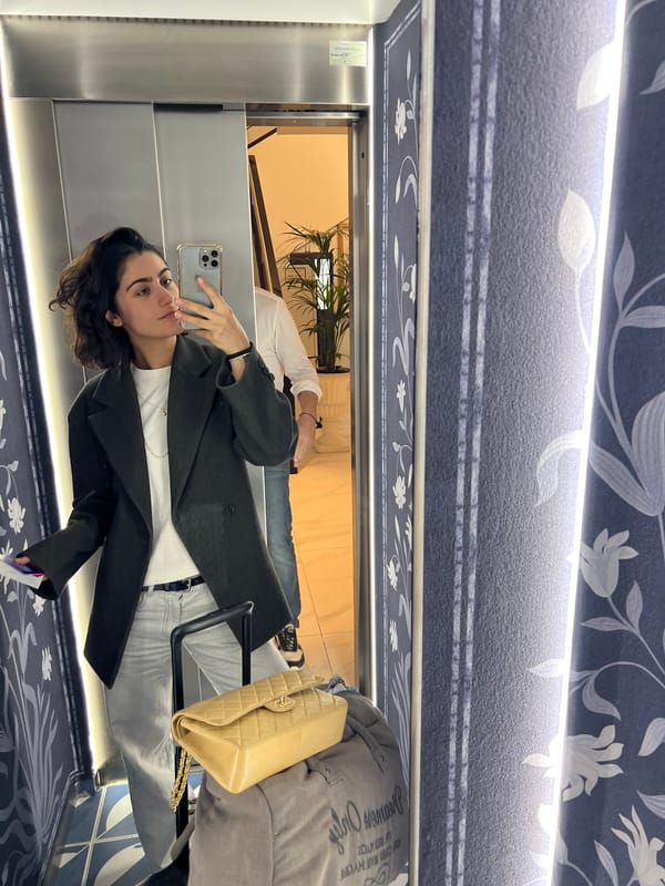 Tourist selfie captured near Ibiza hotel promotional display