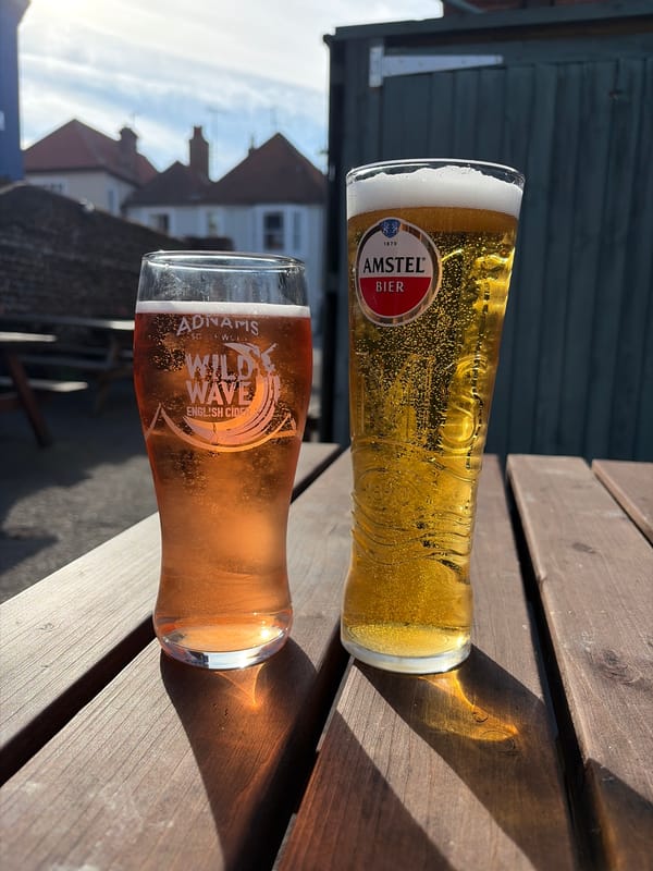 Beer and cider observed on wooden surface in East Suffolk