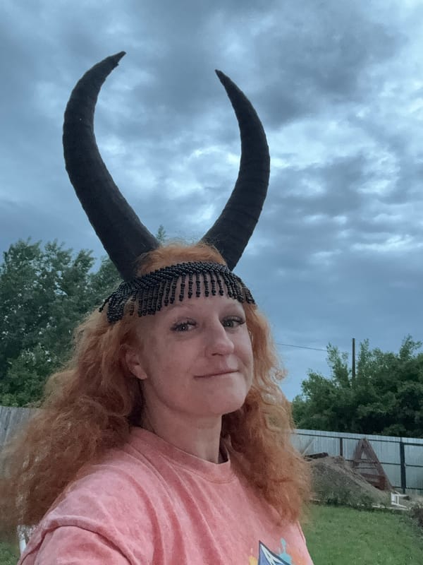 Woman in horned headpiece photographed around Chaikovsky, Russia