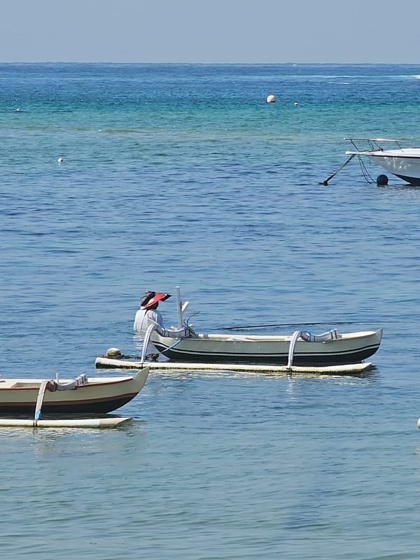 Morning beach scenes documented along Denpasar coastline in Indonesia