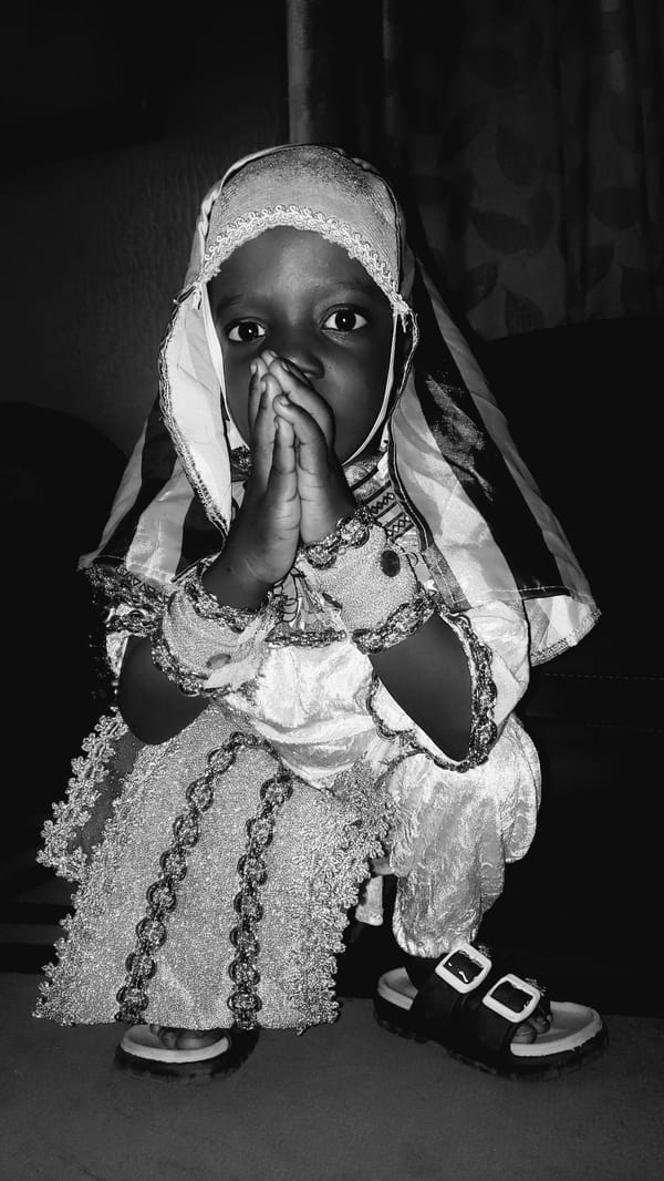 Kids in traditional dress and Spider-Man costumes, Kaduna homes