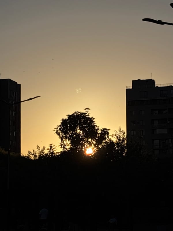 Sunset fades to moonrise over a busy city evening