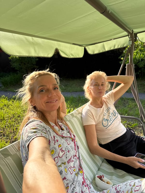 Slow summer day on a backyard swing in Steklyannyi