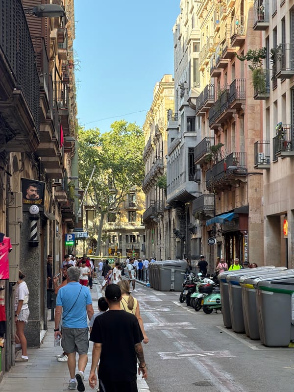 Barcelona streets and plazas on a busy sunny afternoon