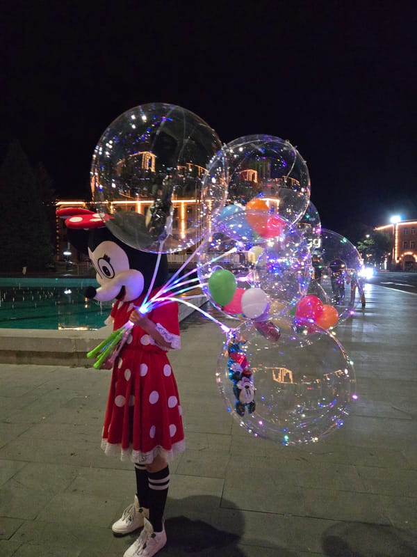 City evening: parks, lit fountains, street food, and festive crowds