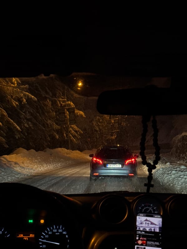 Night driving through snow near Пампорово ski resort