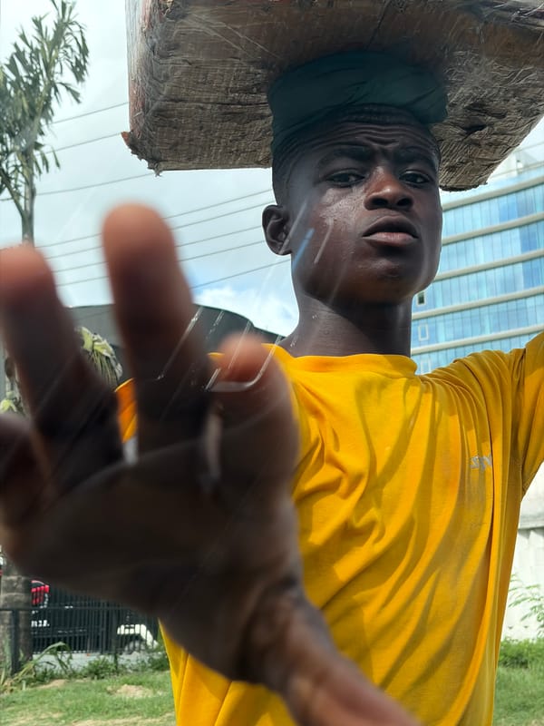 Street vendor sells snacks near Movenpick Hotel in Ikoyi