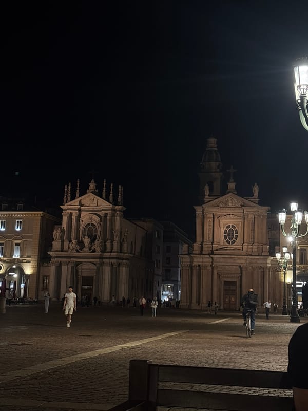 Evening pedestrian activity observed in Turin's historic Piazza San Carlo