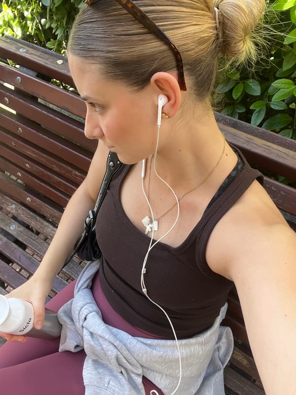 Woman relaxes on park bench in Madrid