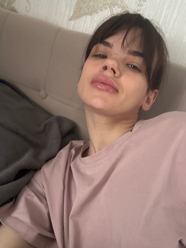 Woman rests on sofa in Rostov-on-Don apartment