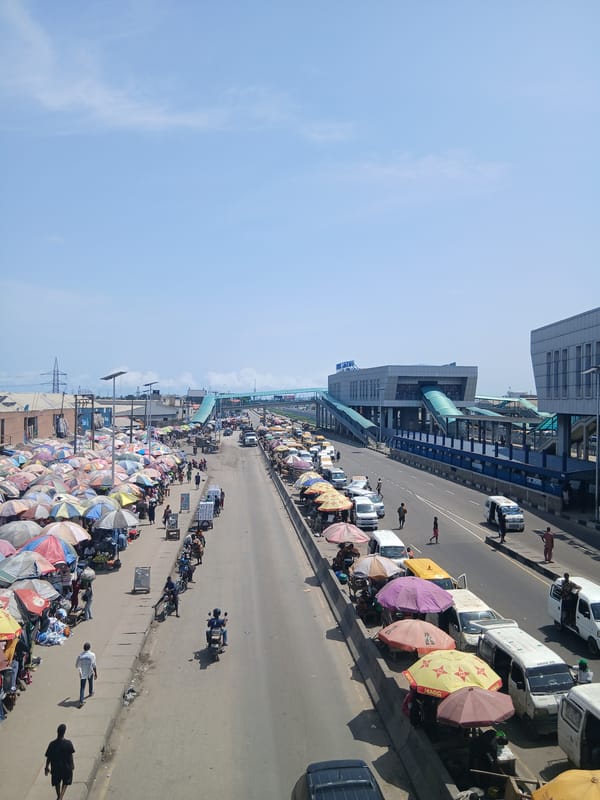 Street vendors line busy highway in Alaiyabiagba, Nigeria