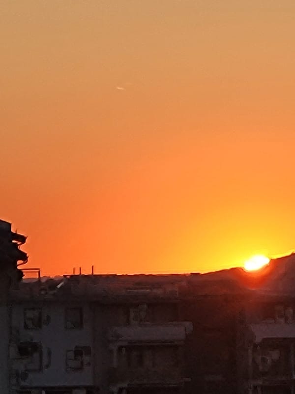 Urban sunset caught from multiple angles in quick succession