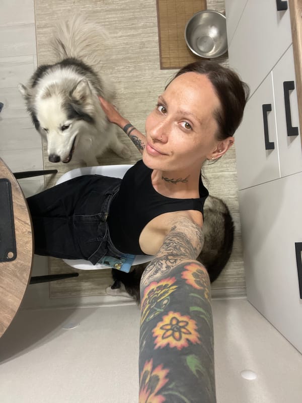 Woman takes selfie with dogs in Izhevsk home