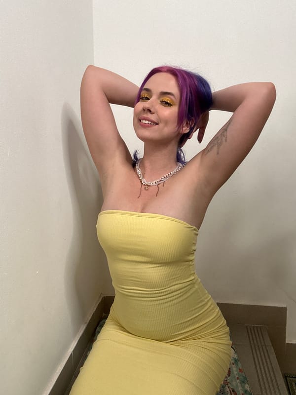Woman poses for photo session in Zagreb wearing yellow dress