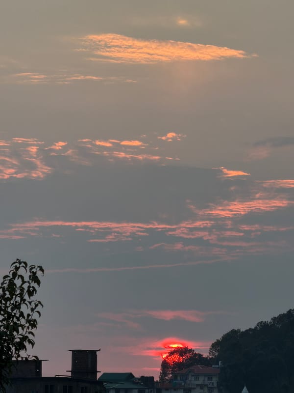 Balcony hangout in Naddi with sunset, hookah, and whisky