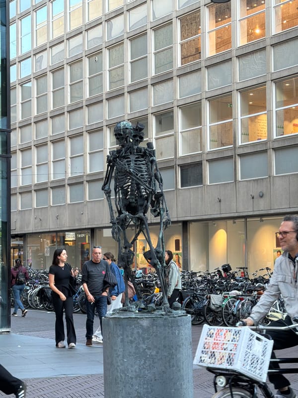 The Hague city center: sculptures, cyclists, and busy shopping streets