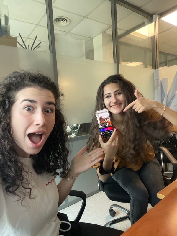 Two women pose for photos in Sofia office