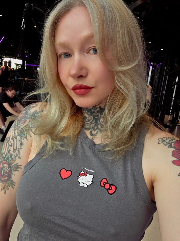 Tattooed blonde woman photographed in Saint Petersburg selfies