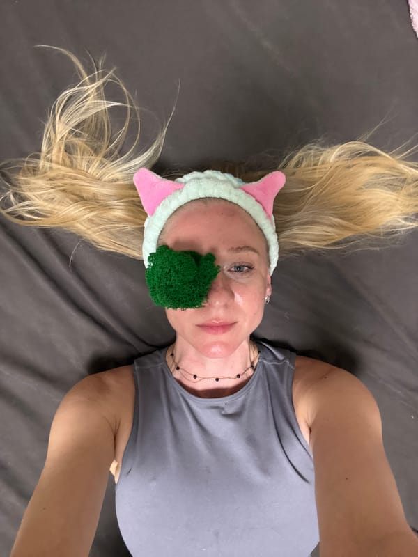 Woman in cat ears headband documented in domestic Sunday activities